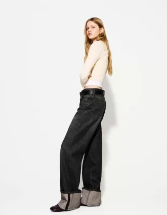 90-talsjeans med vida ben och uppvikbara fållar