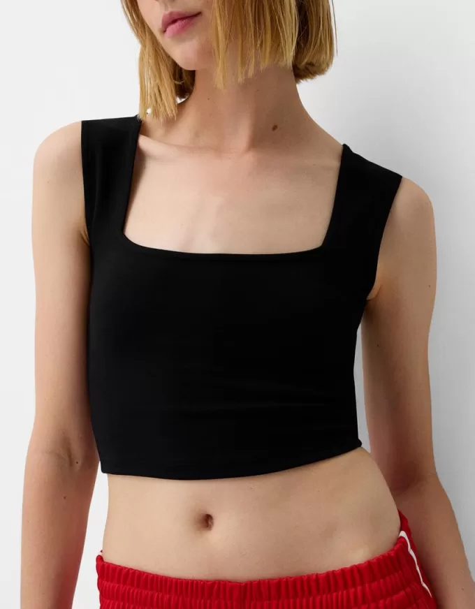 Ärmlös T-shirt med fyrkantig halsringning Ärmlös T-shirt med fyrkantig halsringning