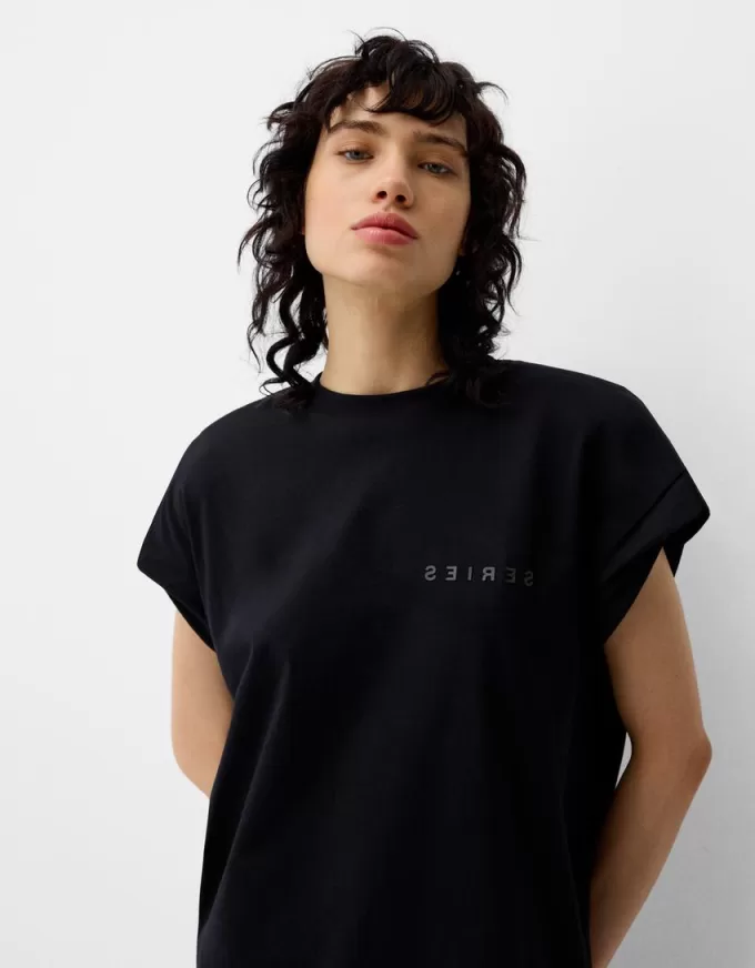 Ärmlös T-shirt med tryck Ärmlös T-shirt med tryck