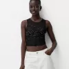 Ärmlös t-shirt i strass i tyll Ärmlös t-shirt i strass i tyll