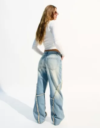 Baggy jeans med fransar