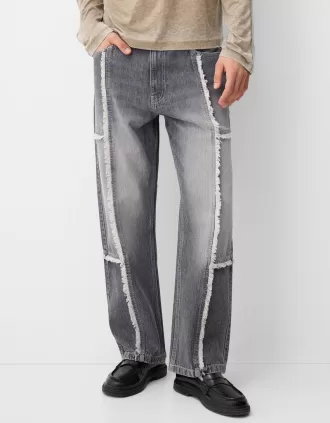 Baggy jeans med fransar