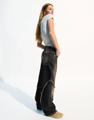 Baggy jeans med fransar