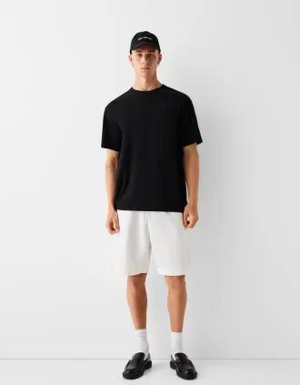 Bermudashorts med vida ben