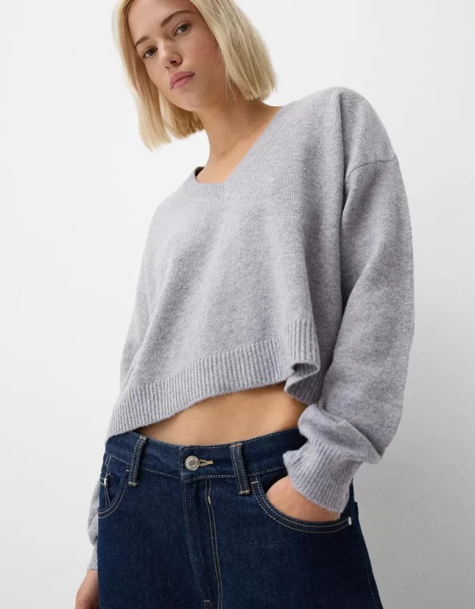 Beskuren tröja med V-ringad