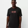Blekt kortärmad T-shirt med AC/DC-tryck Blekt kortärmad T-shirt med AC/DC-tryck