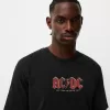 Blekt kortärmad T-shirt med AC/DC-tryck Blekt kortärmad T-shirt med AC/DC-tryck