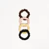 Förpackning med 4 scrunchies Förpackning med 4 scrunchies