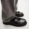 Fransade loafers med tofsar
