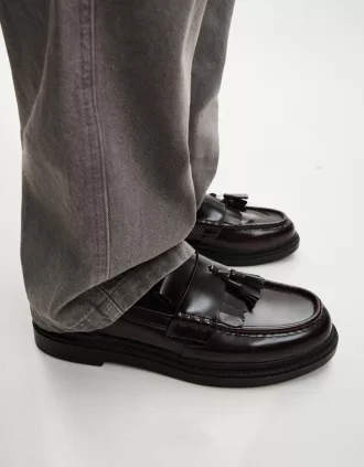 Fransade loafers med tofsar