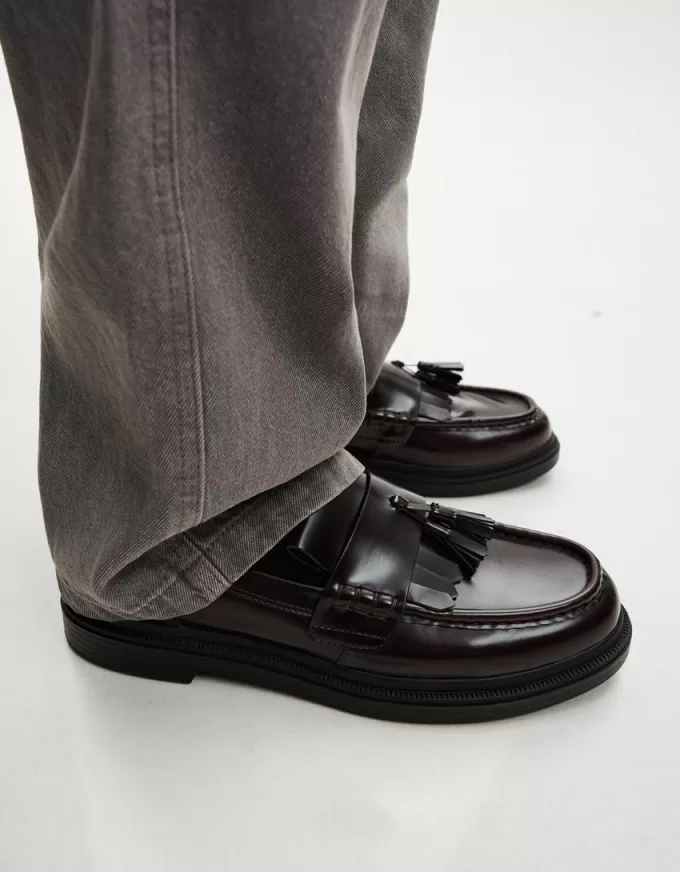 Fransade loafers med tofsar