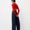 Långärmad bodysuit med utskuren polokrage Långärmad bodysuit med utskuren polokrage