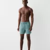 Monokrom boardshorts med boxy-fit passform Monokrom boardshorts med boxy-fit passform