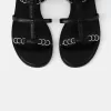 Platta sandaler med ringdetaljer Platta sandaler med ringdetaljer