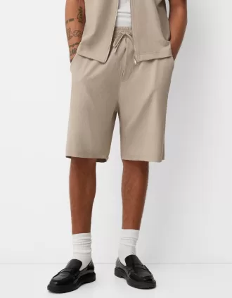 Plisserade Bermuda sweatshorts