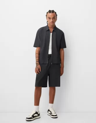 Plisserade Bermuda sweatshorts