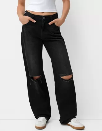 Slitna 90-talsjeans med vida ben