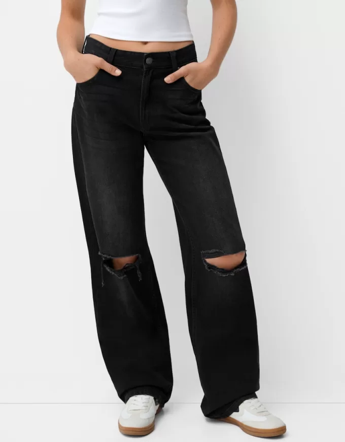 Slitna 90-talsjeans med vida ben Slitna 90-talsjeans med vida ben