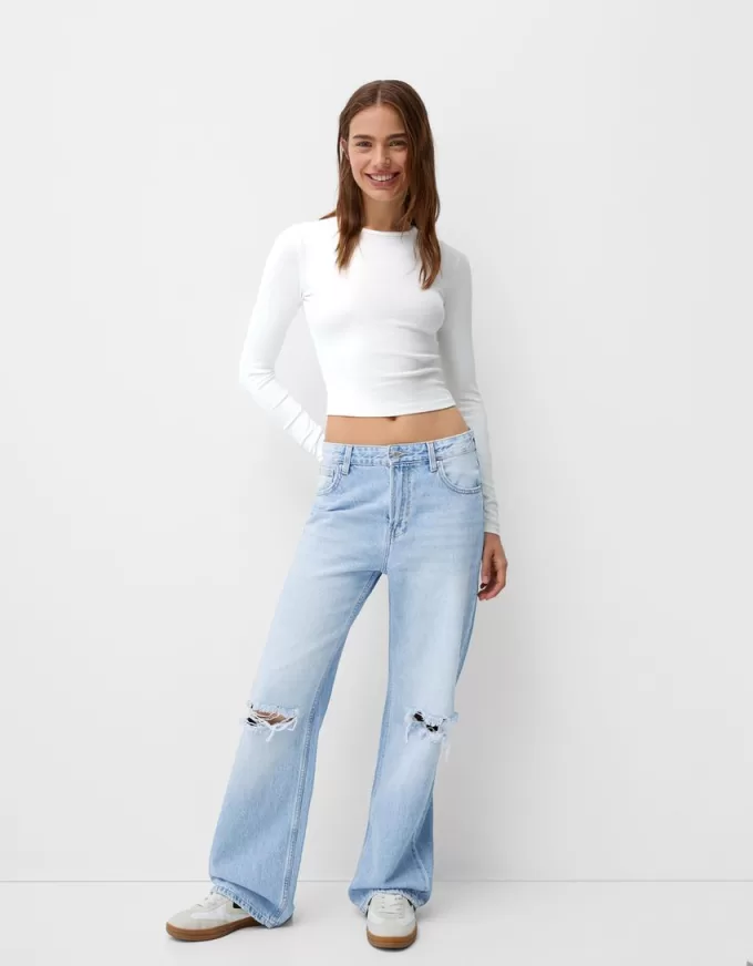 Slitna 90-talsjeans med vida ben Slitna 90-talsjeans med vida ben