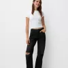 Slitna 90-talsjeans med vida ben Slitna 90-talsjeans med vida ben
