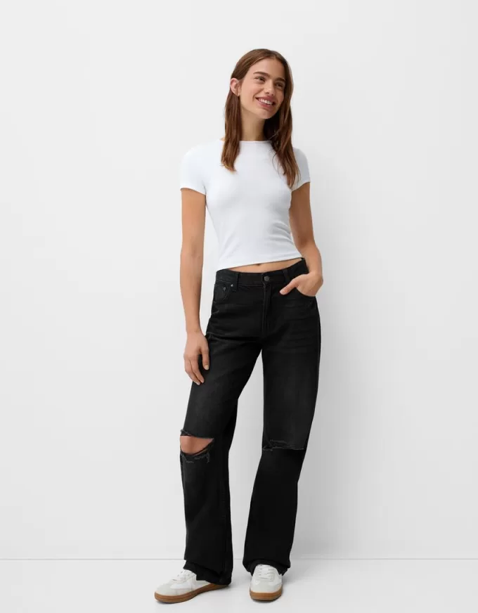 Slitna 90-talsjeans med vida ben Slitna 90-talsjeans med vida ben
