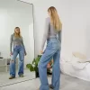 Slitna 90-talsjeans med vida ben Slitna 90-talsjeans med vida ben