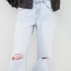 Slitna 90-talsjeans med vida ben Slitna 90-talsjeans med vida ben