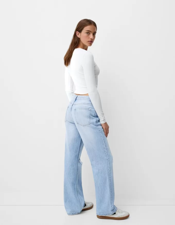 Slitna 90-talsjeans med vida ben Slitna 90-talsjeans med vida ben