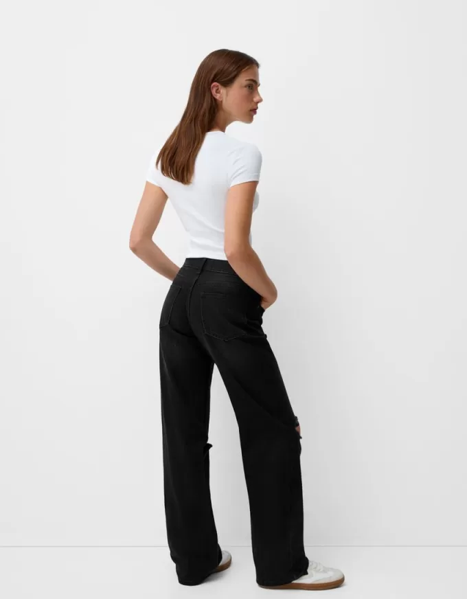 Slitna 90-talsjeans med vida ben Slitna 90-talsjeans med vida ben