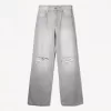 Slitna 90-talsjeans med vida ben Slitna 90-talsjeans med vida ben