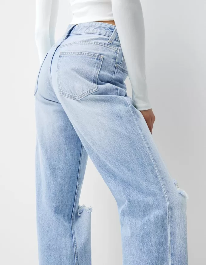 Slitna 90-talsjeans med vida ben Slitna 90-talsjeans med vida ben