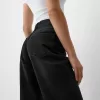 Slitna 90-talsjeans med vida ben Slitna 90-talsjeans med vida ben