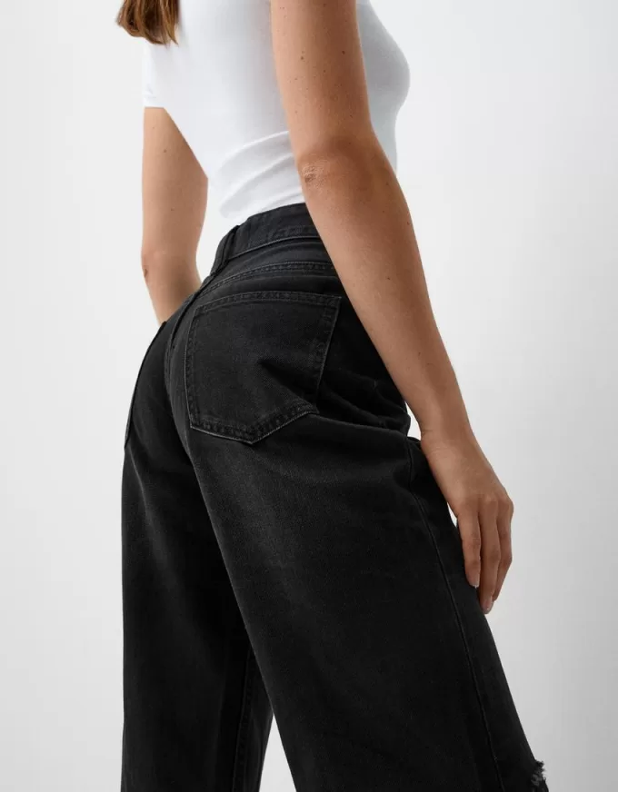Slitna 90-talsjeans med vida ben Slitna 90-talsjeans med vida ben