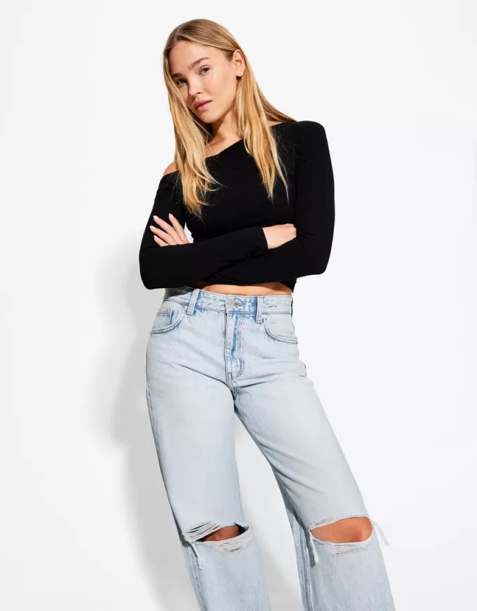 Slitna 90-talsjeans med vida ben Slitna 90-talsjeans med vida ben