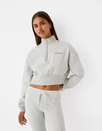 Sweatshirt med dragkedja med broderi