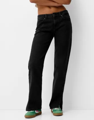 Utsvängda jeans med delad fåll