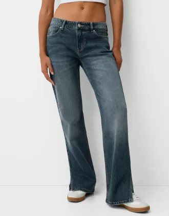 Utsvängda jeans med delad fåll
