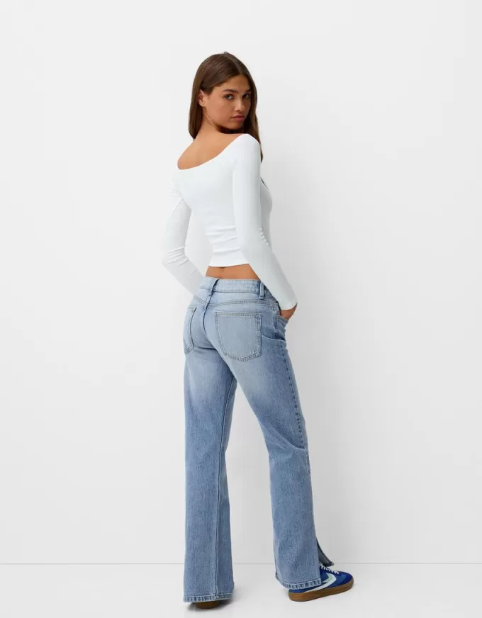 Utsvängda jeans med delad fåll Utsvängda jeans med delad fåll