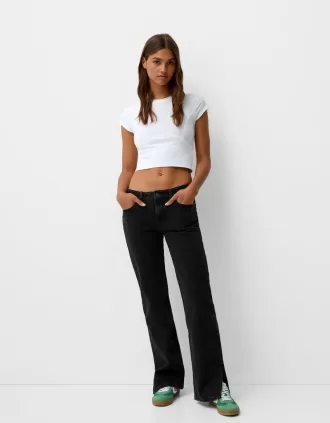 Utsvängda jeans med delad fåll