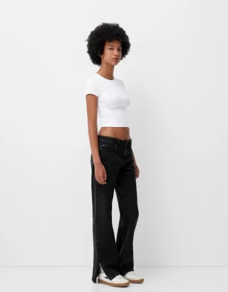 Utsvängda jeans med delad fåll