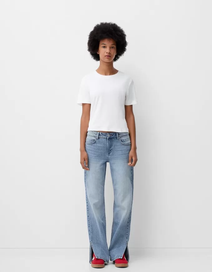 Utsvängda jeans med delad fåll Utsvängda jeans med delad fåll