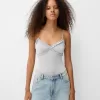 Volang bodysuit med remmar