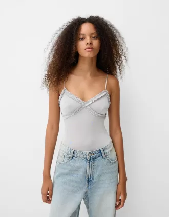 Volang bodysuit med remmar