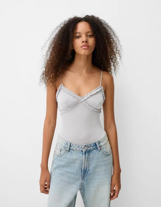 Volang bodysuit med remmar