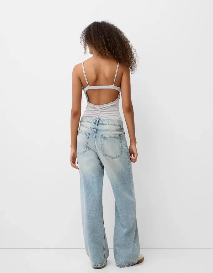 Volang bodysuit med remmar
