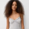 Volang bodysuit med remmar