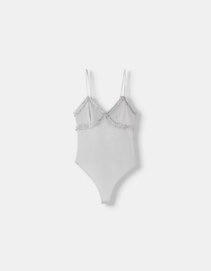 Volang bodysuit med remmar