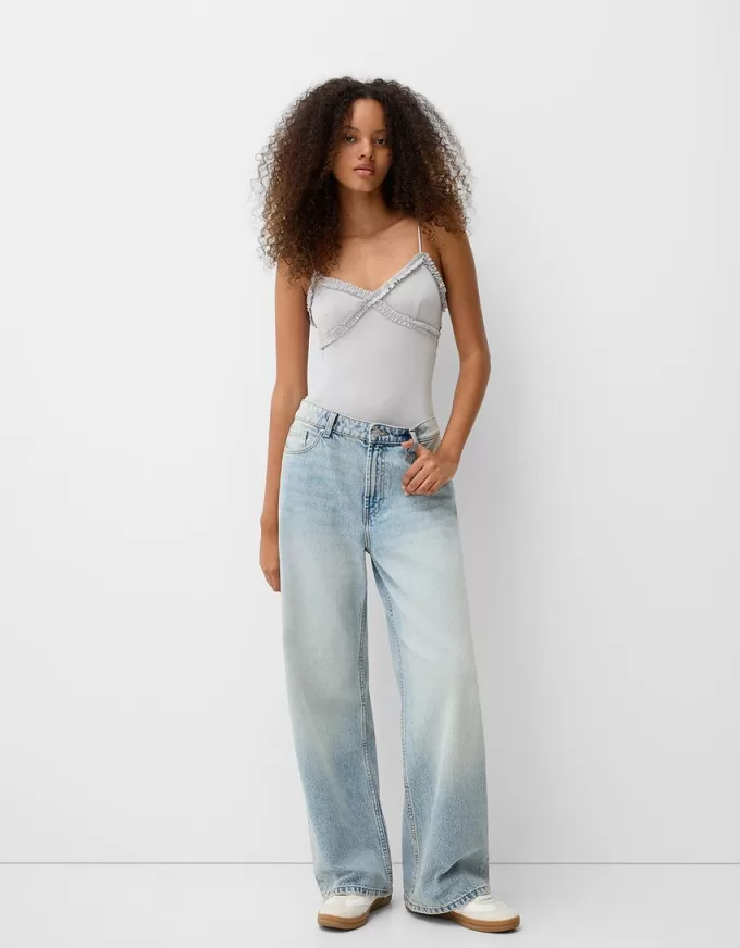 Volang bodysuit med remmar